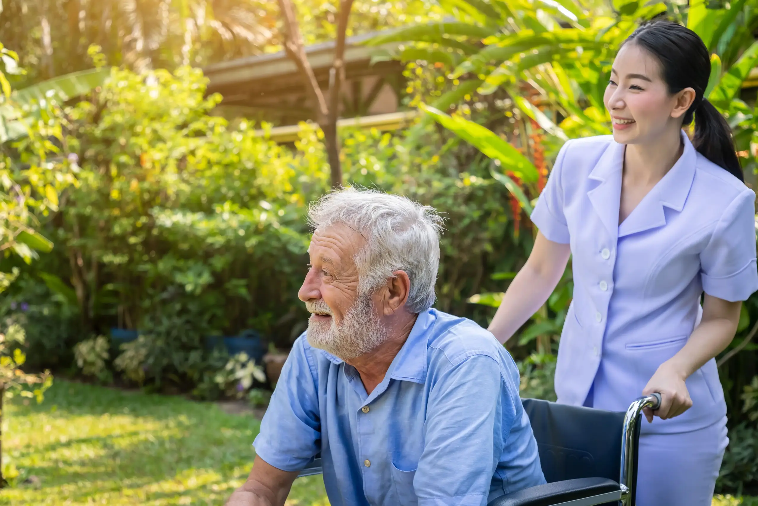 happy-nurse-take-care-elderly-man-wheelchair-garden-nursing-home (1) (1)